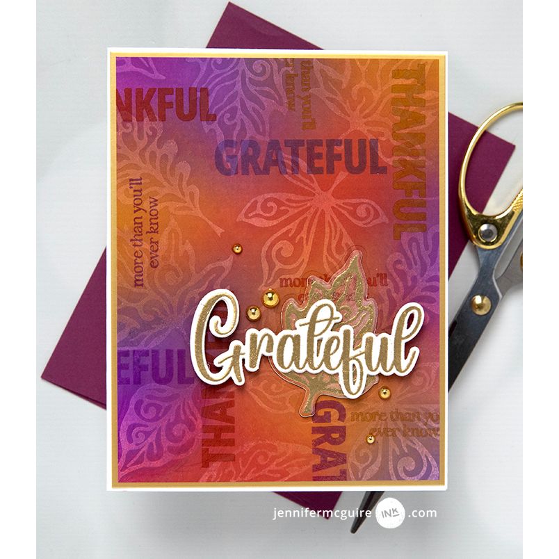 Gina K Designs Dancing Leaves card with the gold sentiment saying "Grateful" Stenciled leaf background | color-code:alt1