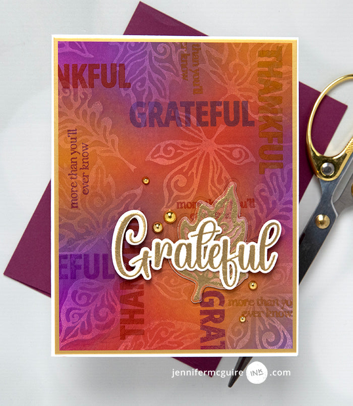 Gina K Designs Dancing Leaves card with the gold sentiment saying "Grateful" Stenciled leaf background | color-code:alt1