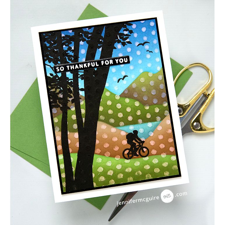 Gina K Designs Mountain Silhouettes Stamp with polka dot stencil over top. Sentiment reads "so thankful for you" while a cyclist rides on the hills in the background. | color-code:alt1