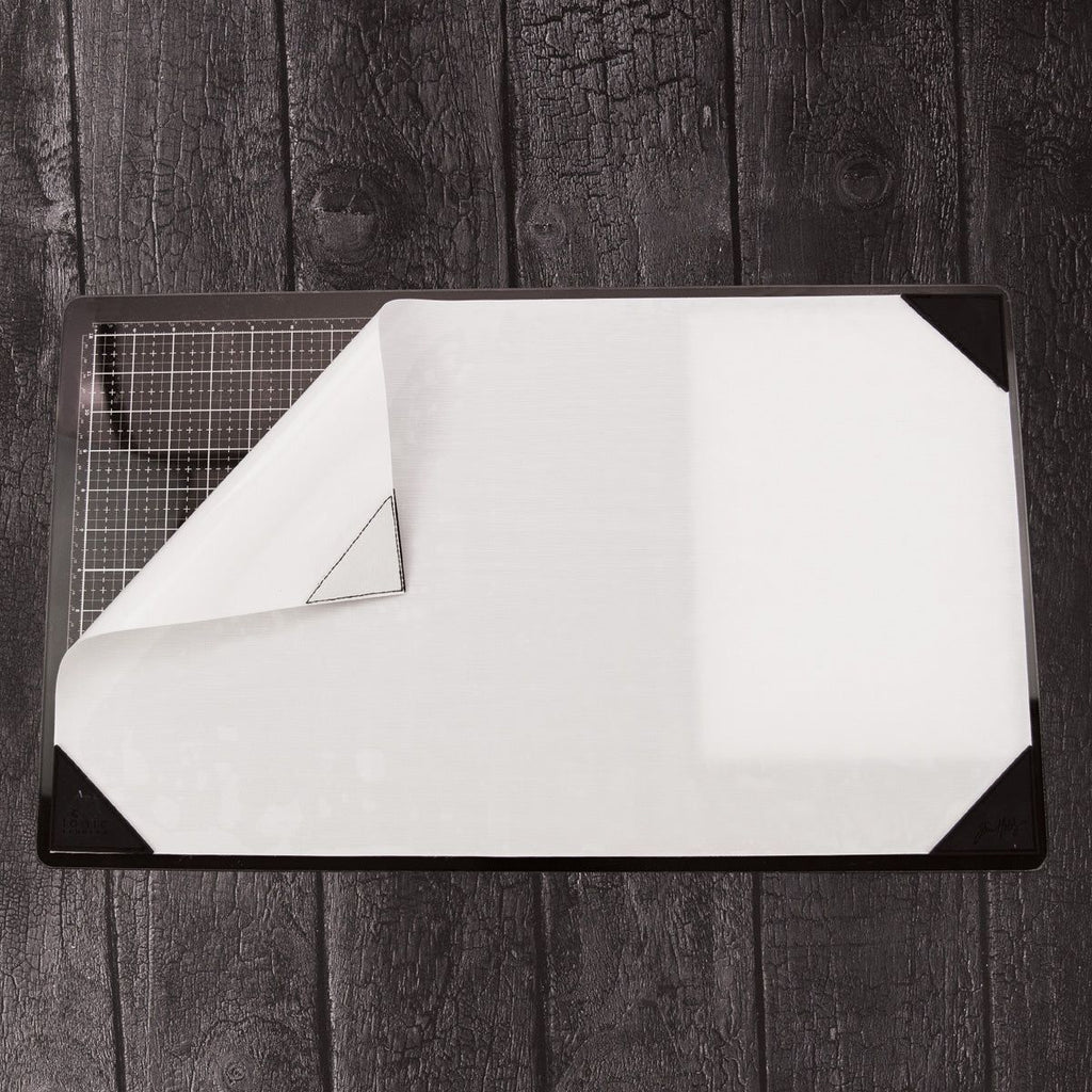Tim Holtz Tonic Media Surface Mat 4497e flipped corner wood background