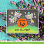 A handmade Halloween greeting card featuring a glittery orange jack-o'-lantern, two cute fairy stickers, and a green gradient grass base with the text 'HAPPY HALLOWEEN!'. | color-code:alt1
