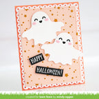 A handmade Halloween greeting card featuring two cute white ghost cutouts with smiling faces, pink cheeks, and gold star confetti on a peach and orange layered card. Two black banner tabs read 'HAPPY HALLOWEEN!'. | color-code:alt1
