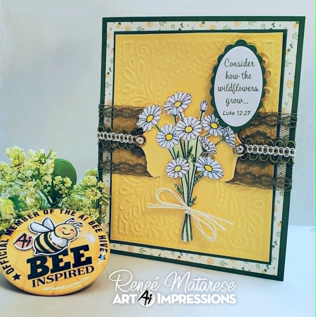 A handmade greeting card featuring a yellow embossed background, a bouquet of white daisies with yellow centers, brown lace strips, and a white oval label with a Bible verse. The card is displayed upright next to a round yellow bee-themed pin, with a white background and a watermark at the bottom.