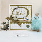 A handmade greeting card with a white and beige gingham pattern, olive green scalloped borders, blue birds, and a large olive green ribbon bow with a rose. 
