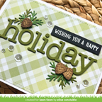 A handmade holiday greeting card featuring the word 'holiday' in olive green die-cut letters over a light green and white gingham patterned background. The card is decorated with three pinecones in brown and green, clear rhinestones, and a black banner that reads 'WISHING YOU A HAPPY'.
