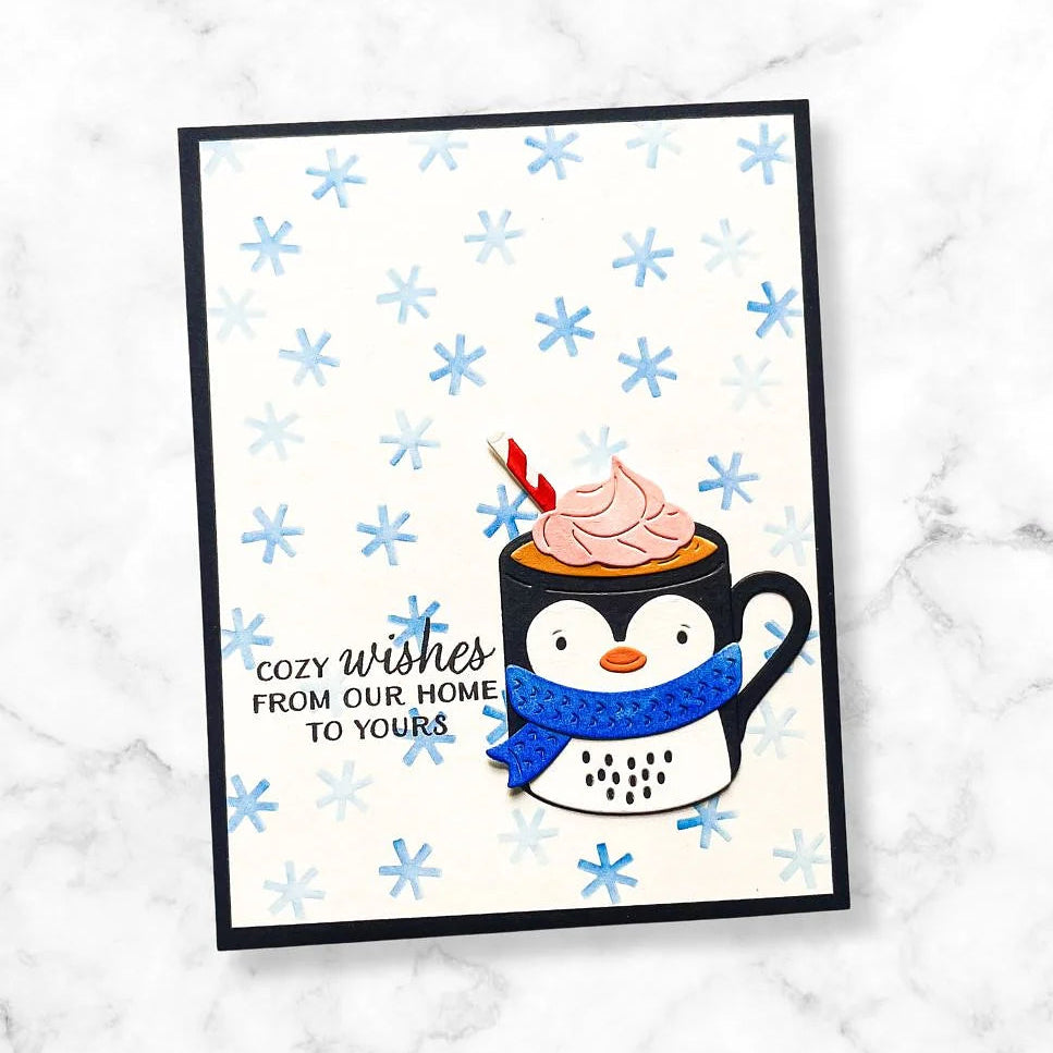 Spellbinders Snow Joy Stencil Set stn-109 blue and white snowflake background hot chocolate cup penguin cozy wishes card
