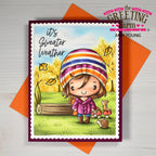 Card with a girl in a colorful hat and sweater, surrounded by autumn elements, on an orange envelope with 'The Greeting Farm' branding.