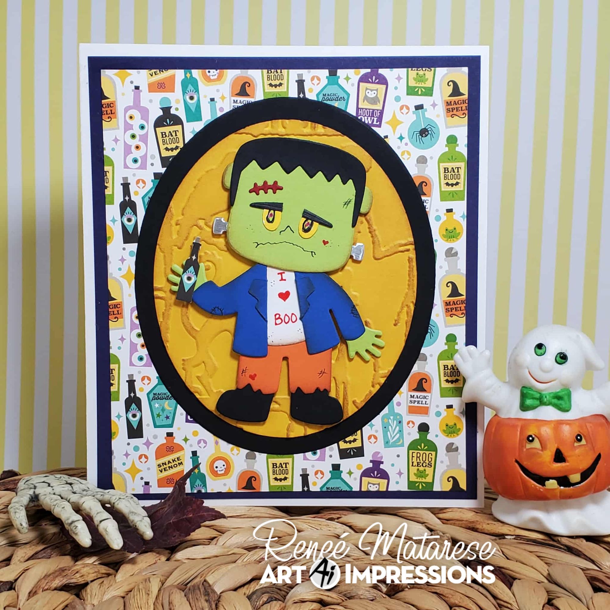 Halloween-themed card with a cartoon Frankenstein design on a patterned background, featuring Art Impressions branding.