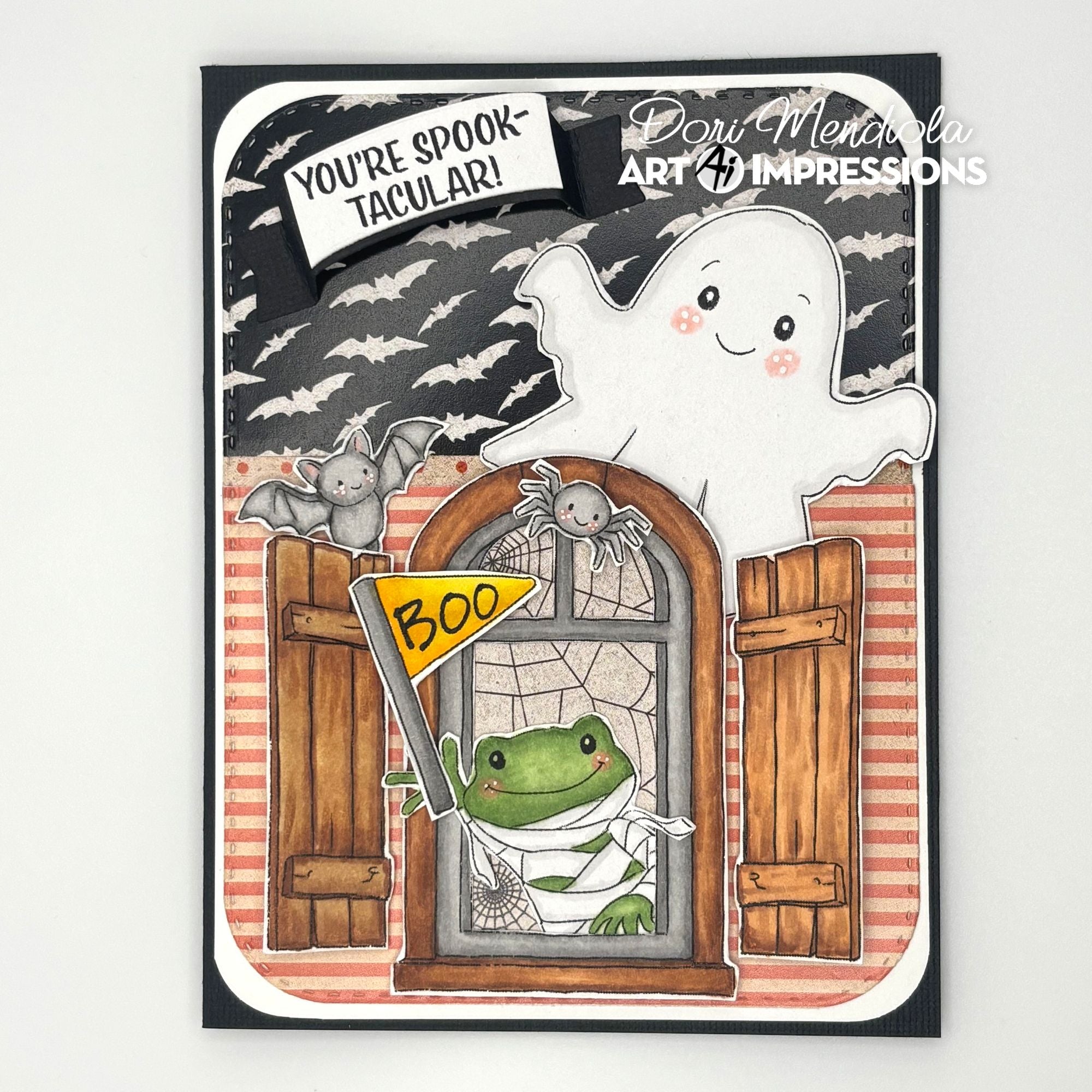 Halloween-themed card with ghost, frog, and spider decorations, featuring the brand 'Art Impressions'.