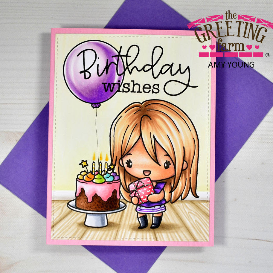 Birthday card with a girl holding a cake and balloon, on a purple envelope with 'The Greeting Farm' branding.