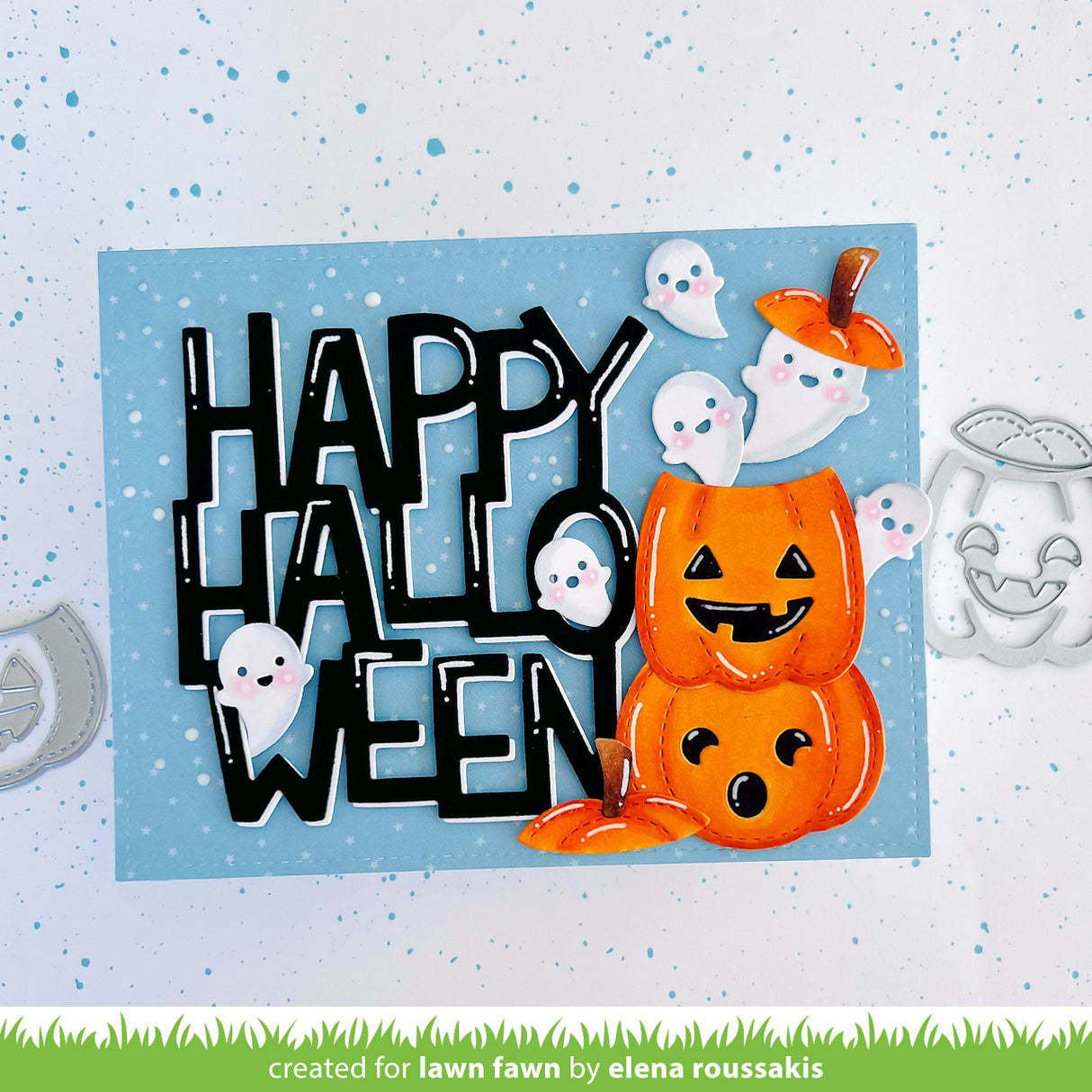 Halloween-themed card with 'Happy Halloween' text and jack-o'-lantern design on a blue background.