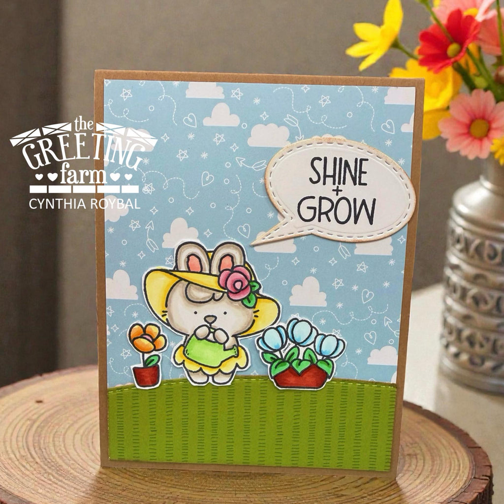 Bunny Watering Flowers with Speech Bubble Sentiment that says 'Shine and Grow'