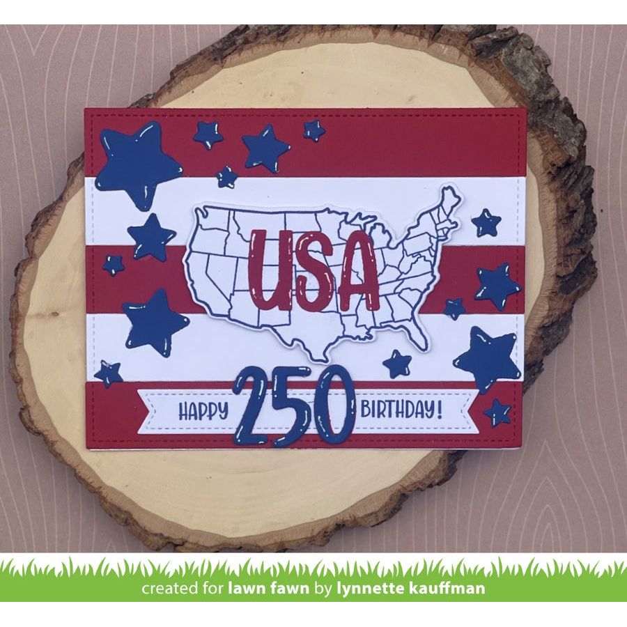 Card with USA map and stars on a wooden slice, celebrating the 250th birthday.