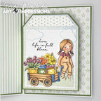 Card with a girl and flower cart design, featuring Art Impressions branding.