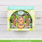 Card with a quokka and text 'You quokka my world!' on a wooden surface.