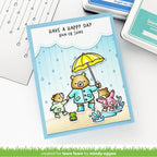 Card with bears in raincoats and an umbrella, text 'Have a happy day rain or shine', on a white background.