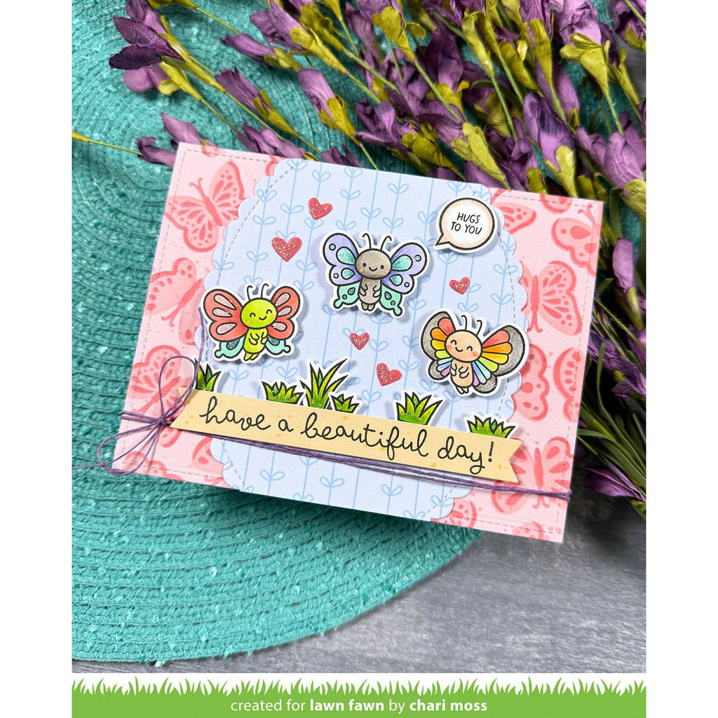 Card with butterfly designs and text 'have a beautiful day!' on a floral background