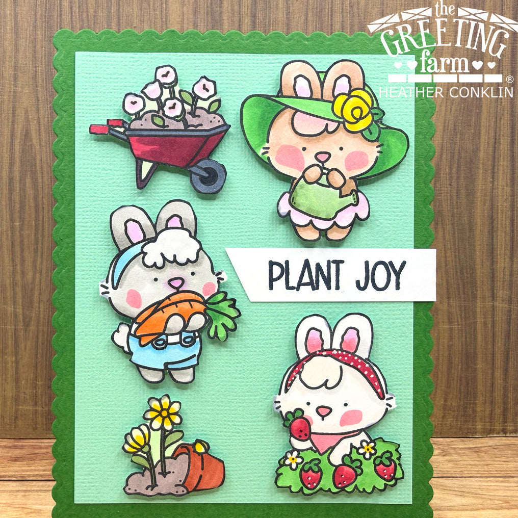 Card with cartoon bunnies planting flowers and vegetables, featuring 'The Greeting Farm' branding.
