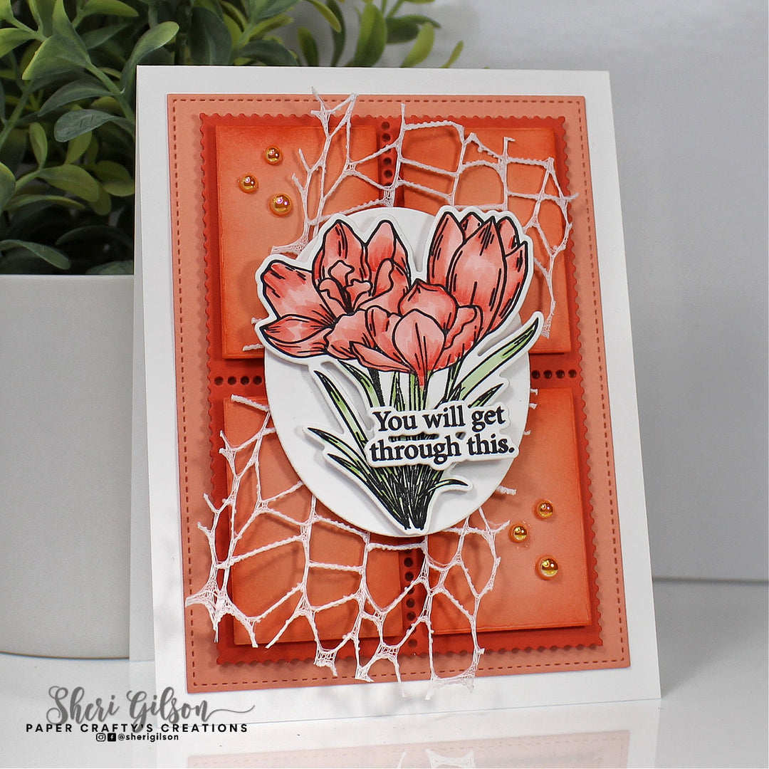 Card with floral design and motivational text on an orange background, featuring a plant in the background.