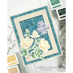 Card with floral design and text 'Here's to bright and beautiful days ahead' surrounded by stamping supplies.