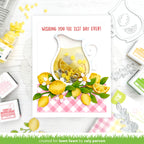 Card with lemon-themed design and text 'Wishing you the zest day ever!' surrounded by stamping supplies.