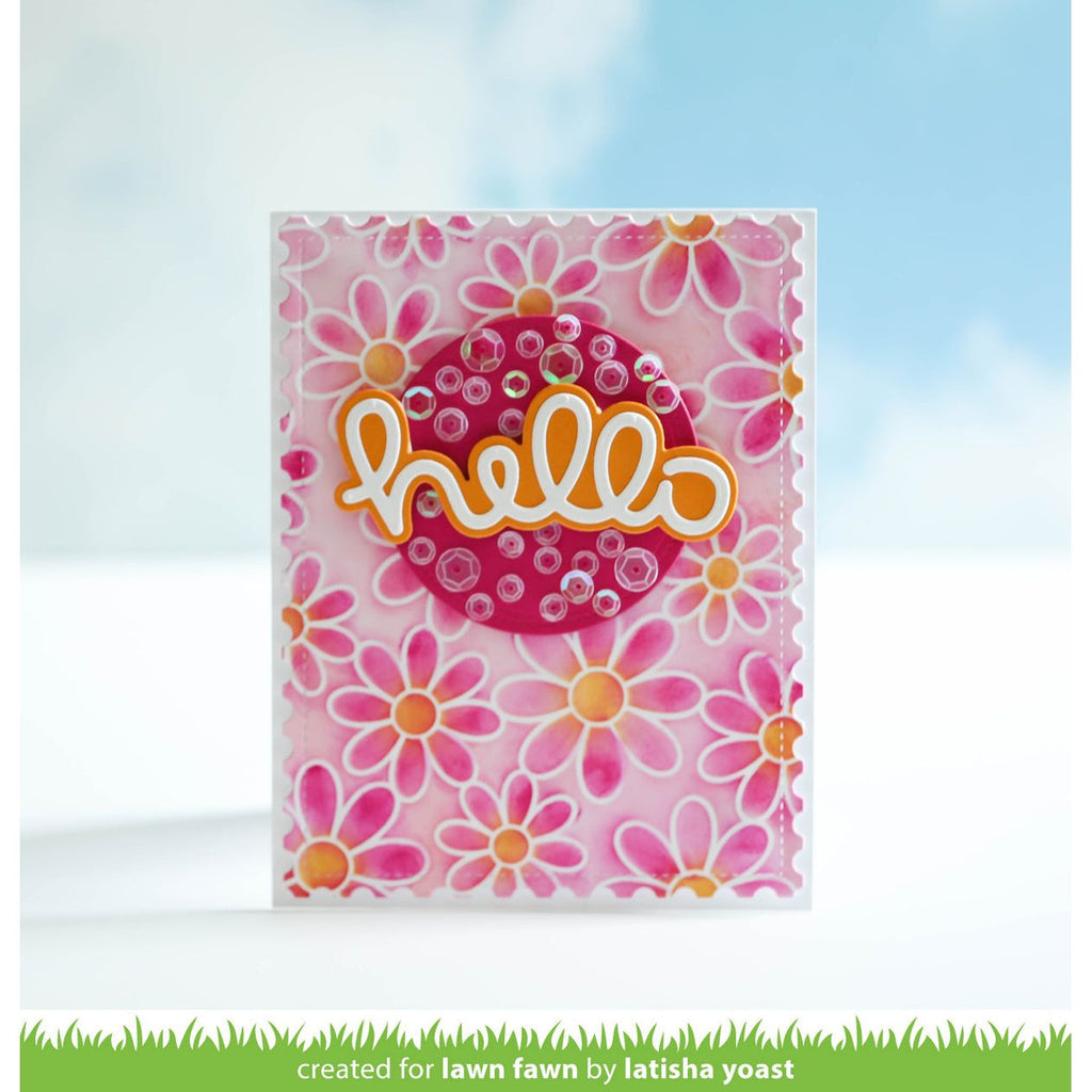 Card with pink floral design and 'hello' text on a blurred outdoor background