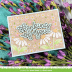 Card with 'thinking of you' text and floral design on a floral background