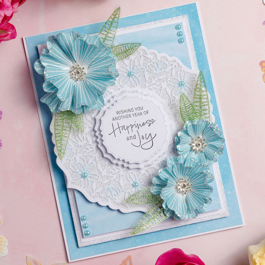 Chloe's Creative Cards Exquisite Flower Stamp and Cut and Emboss Folder Bundle blue background floral lace sparkles blue striped flowers card