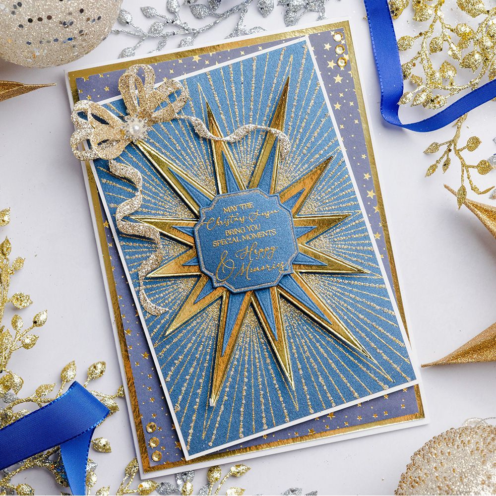 Chloe's Creative Cards Starlit Star Die and Stamp Set c-diest-stars blue and gold star with sparkle bow christmas card