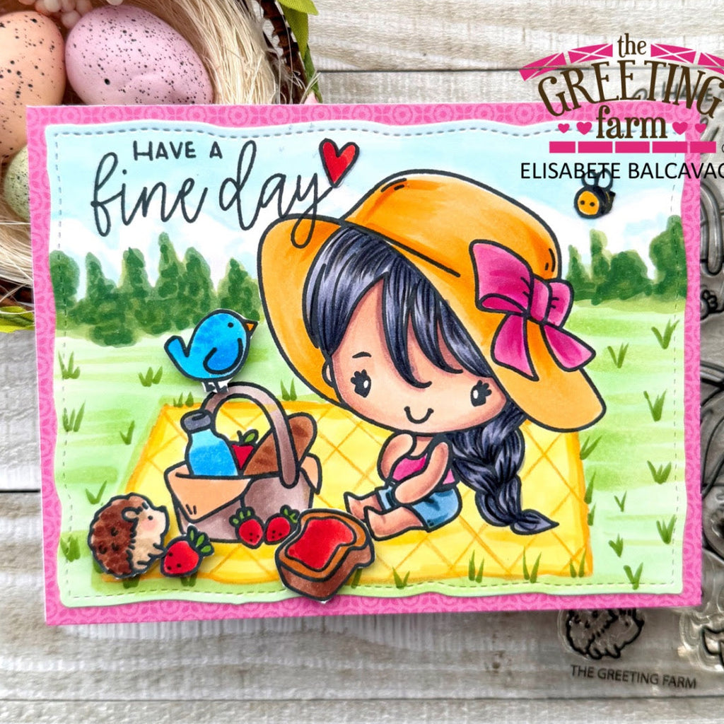 Colorful card with a cartoon girl in a yellow hat and picnic basket, featuring 'The Greeting Farm' branding.