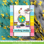Colorful card with a globe, books, and 'sending smiles' text on a striped background