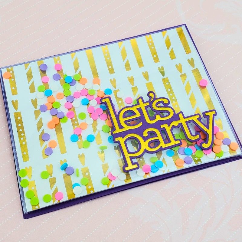 Colorful card with 'let's party' text and confetti on a light background