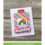 Colorful card with rainbow design and 'Thanks So Much' text on a wooden surface, created by Audrey Tokach for Lawn Fawn.