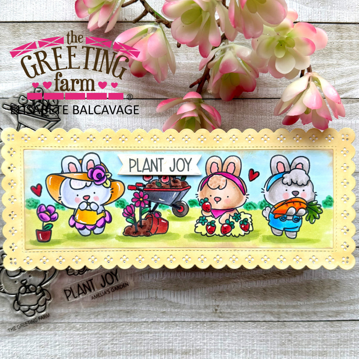 Colorful yellow slimline card with bunnies and 'Plant Joy' text on a wooden background with flowers.