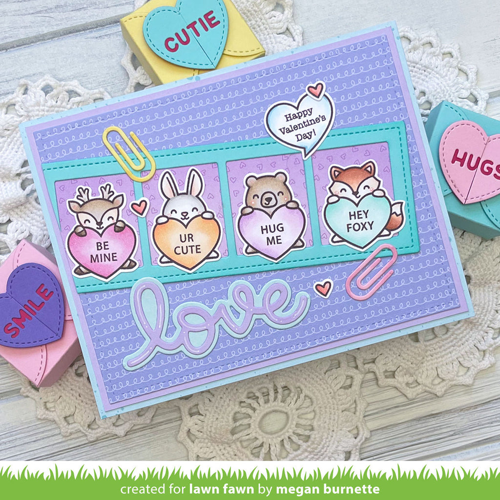 Valentine's Day card with animal-themed hearts and 'love' text on a decorative background.
