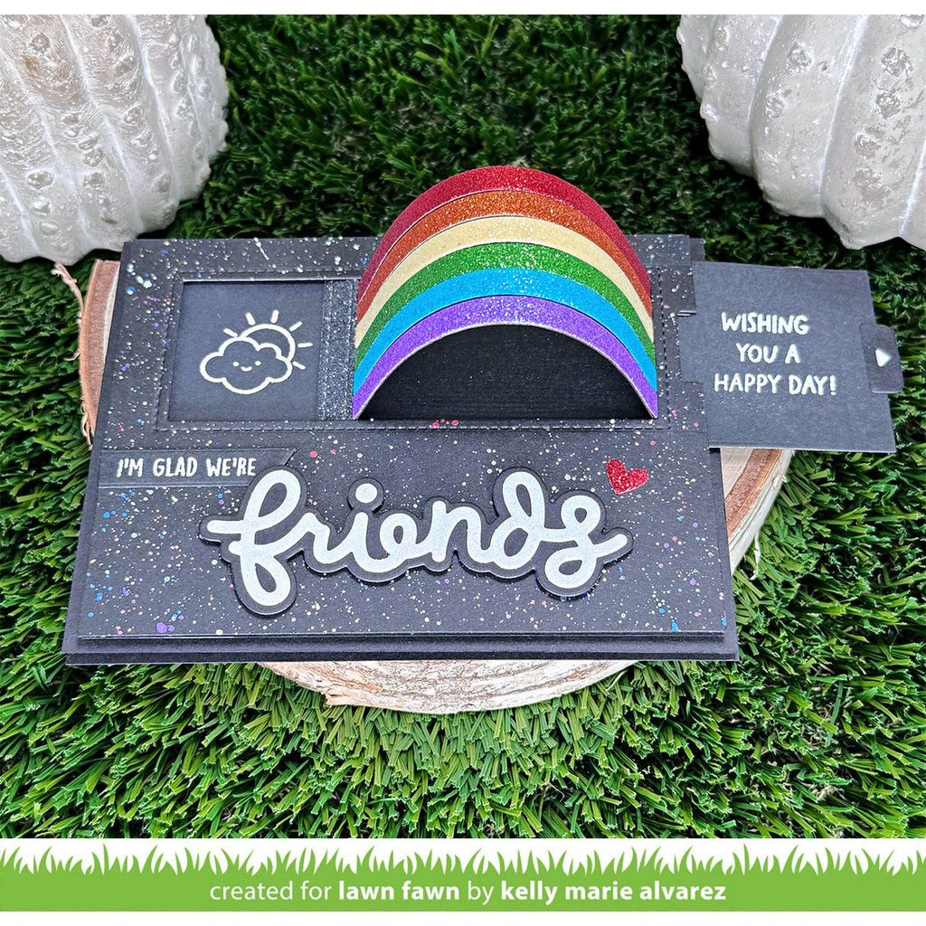 Decorative card with rainbow and text with sentiment 'I'm Glad We're Friends'