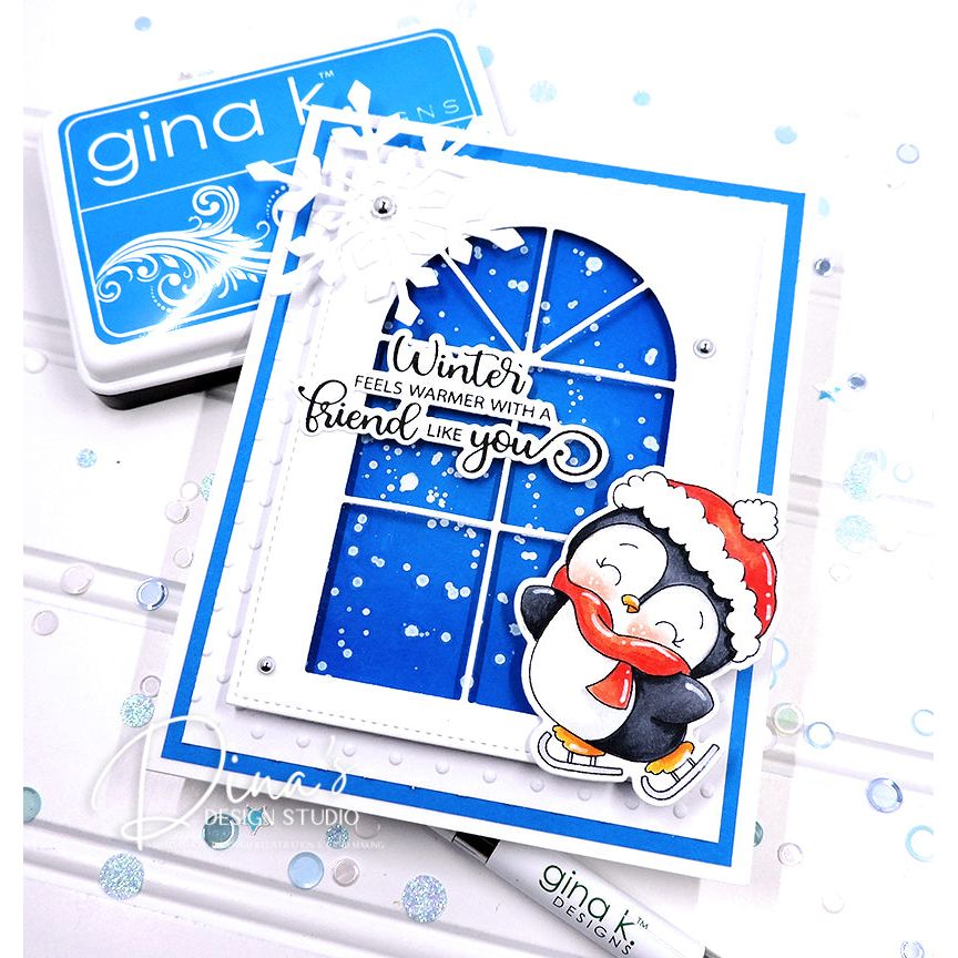 Card with penguin design and 'Winter feels warmer with a friend like you' text, featuring Gina K Designs.