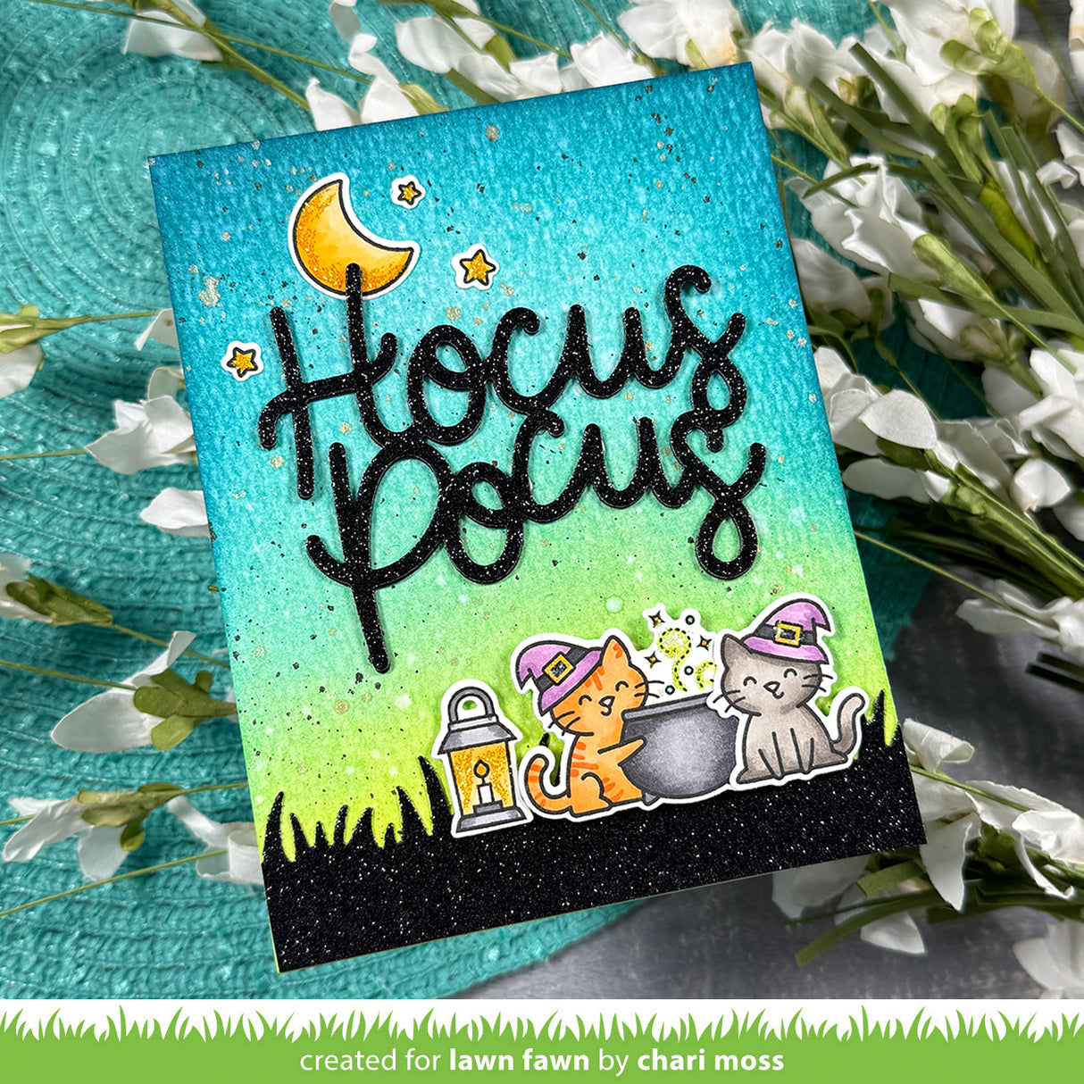 Lawn Fawn Hocus Purr-cus! Stamps Dies and Coloring Stencils Blue and green card containing the cut out phrase hocus pocus | color-code:alt1