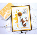 Card with a cow and sunflower design and 'gina k' branding in the background. | color-code:alt1