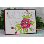 Card with 'MISS YOU' text and floral design, featuring a pink rose, on a white background.
