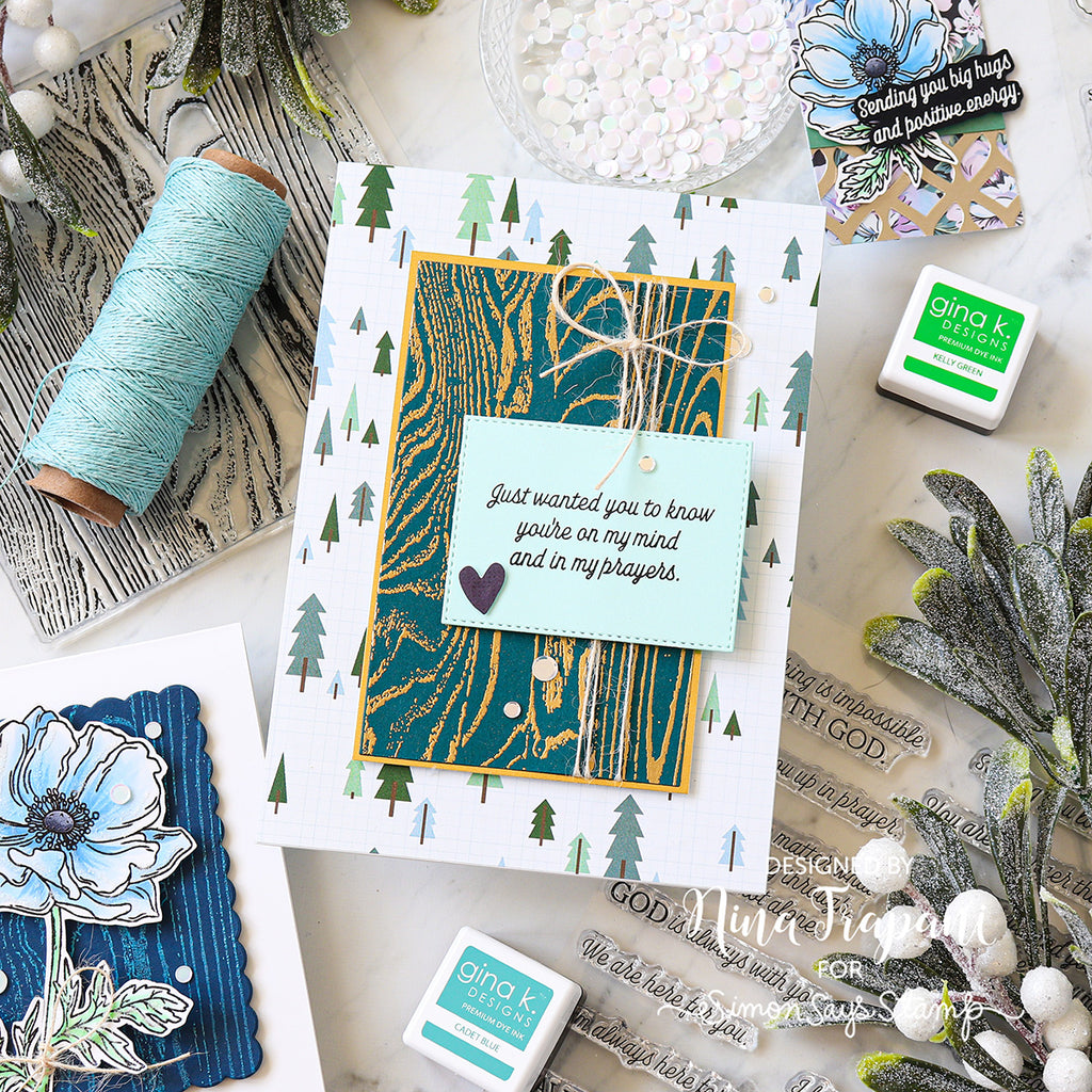 Card with nature-themed design and decorative elements on a white surface