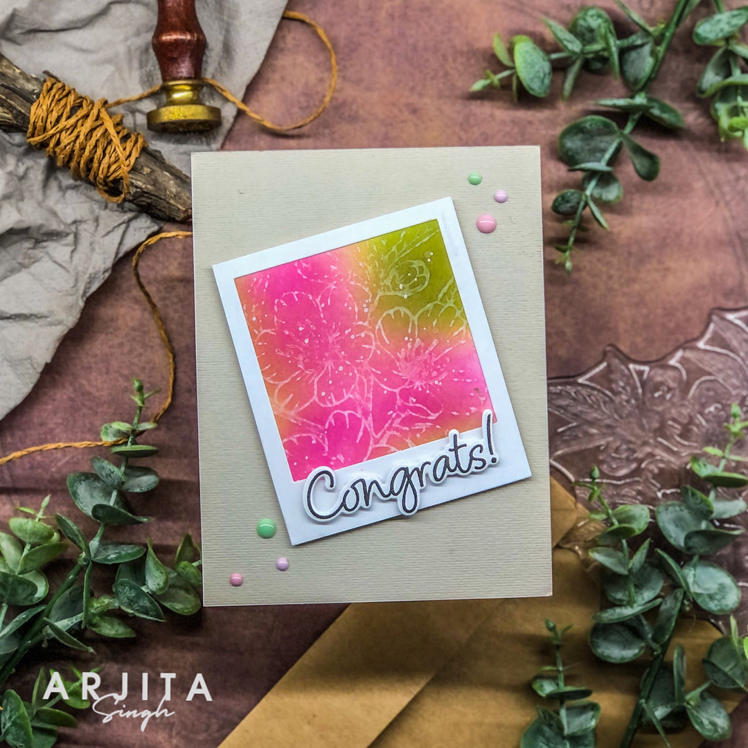 Greeting card with 'Congrats!' text on a decorative background with greenery and a stamp.