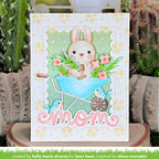 Greeting card with a bunny in a wheelbarrow and flowers, featuring the word 'mom'.
