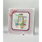 Greeting card with floral design and pink bow on a light gray background