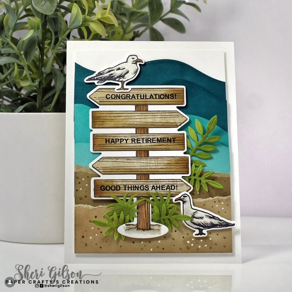 Greeting card with wooden signpost design featuring birds and text on a white background.