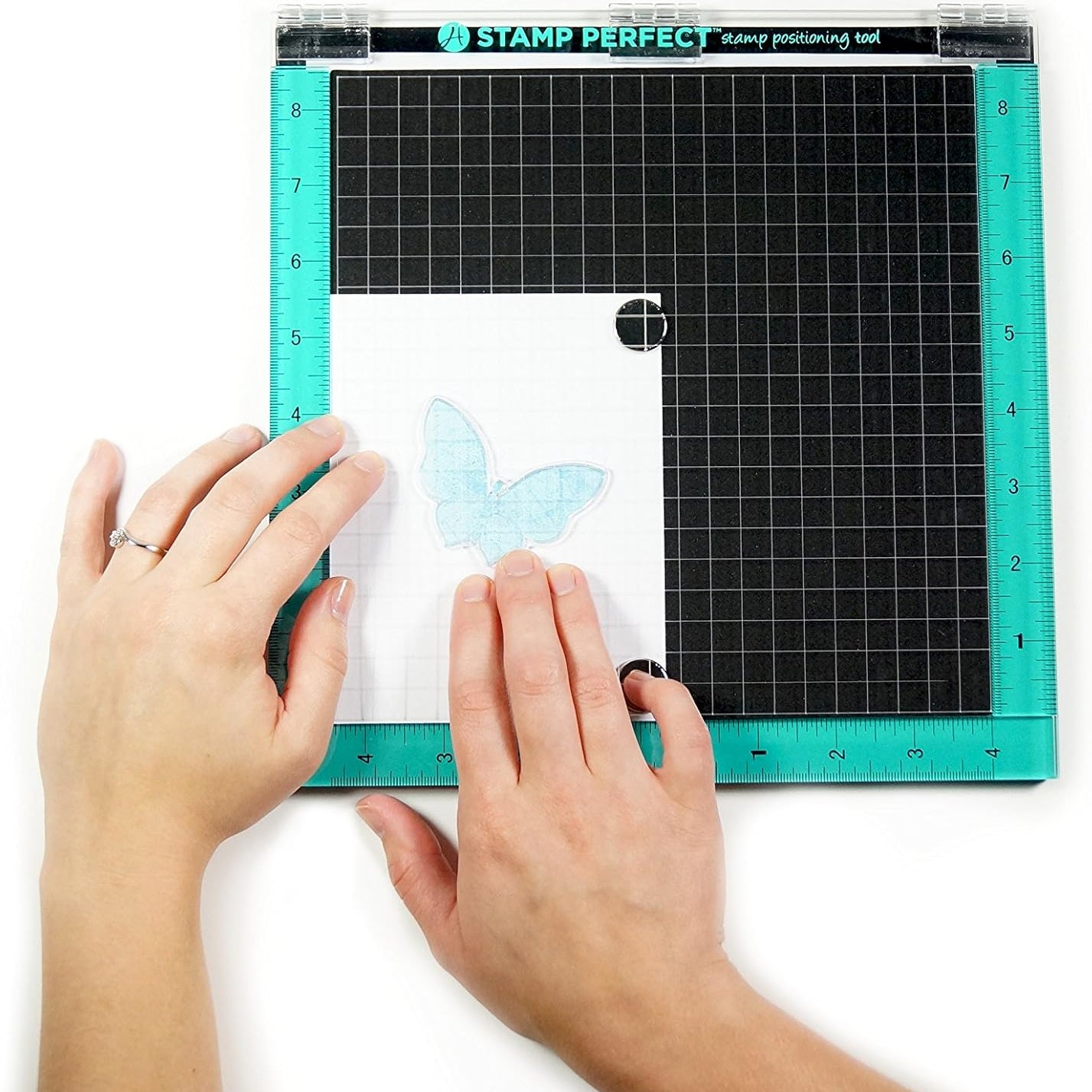 Hampton Art 10 x 10 Stamp Perfect Positioning Tool AC0746 in use pressing ink to paper