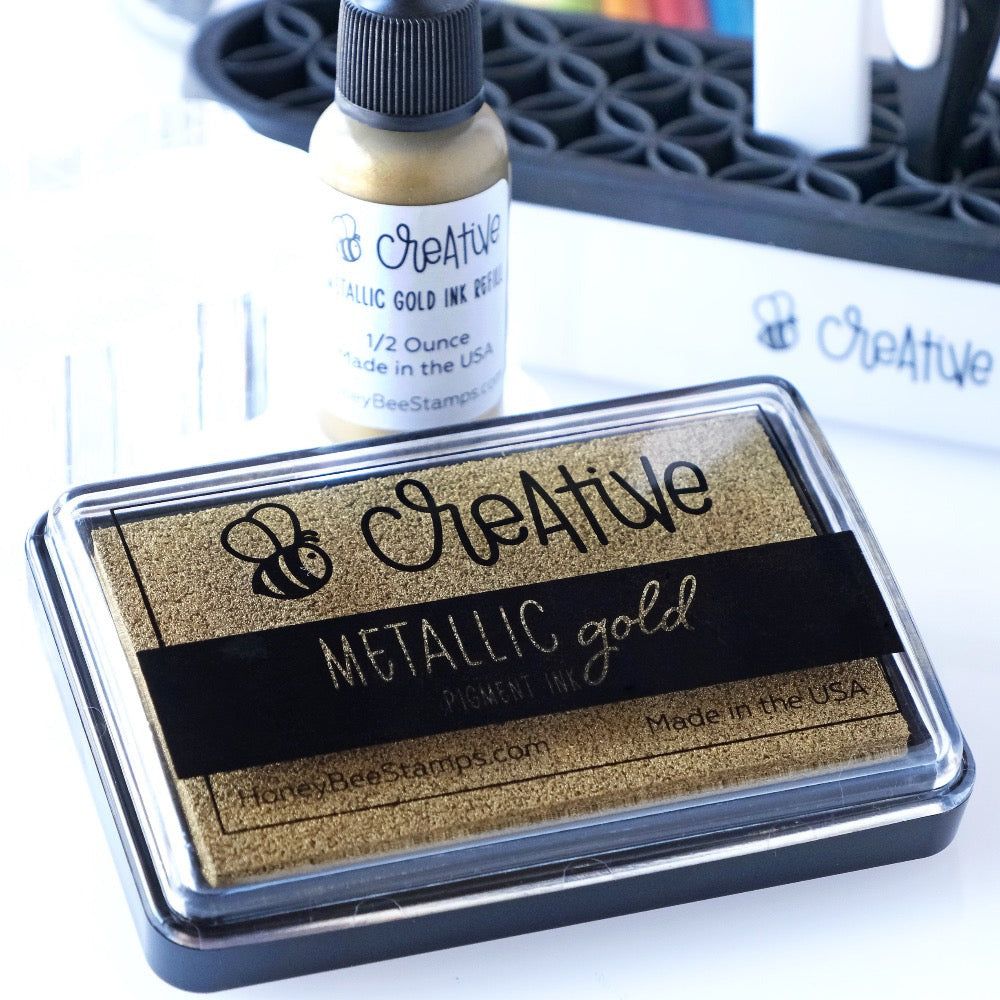 Honey Bee Metallic Gold Pigment Ink Pad And Reinker Bundle Ink Pad And Reinker on Desk