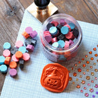 Honey Bee Sweet And Spooky Wax Melts hbtl-wax25 Glamour Shot of Pellets and Seal with Stamper
