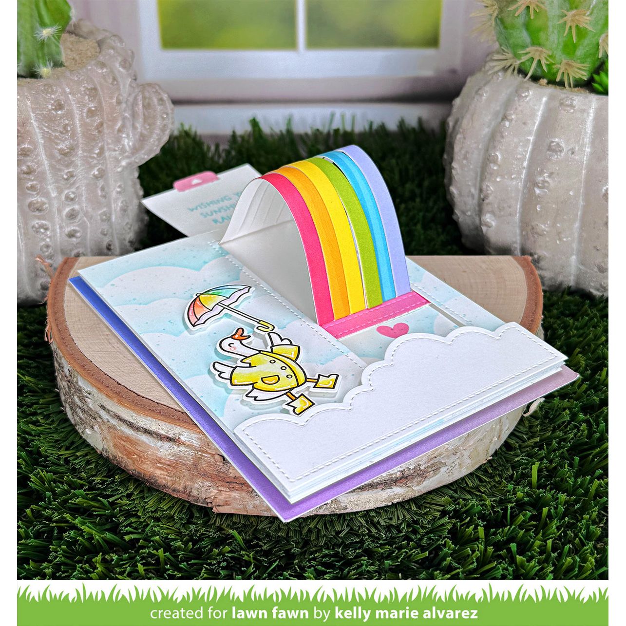 Interactive Card with Dog in Raincoat and Umbrella with Rainbow and Sentiment 'Wishing You Sunshine and Rainbows!' flat angle