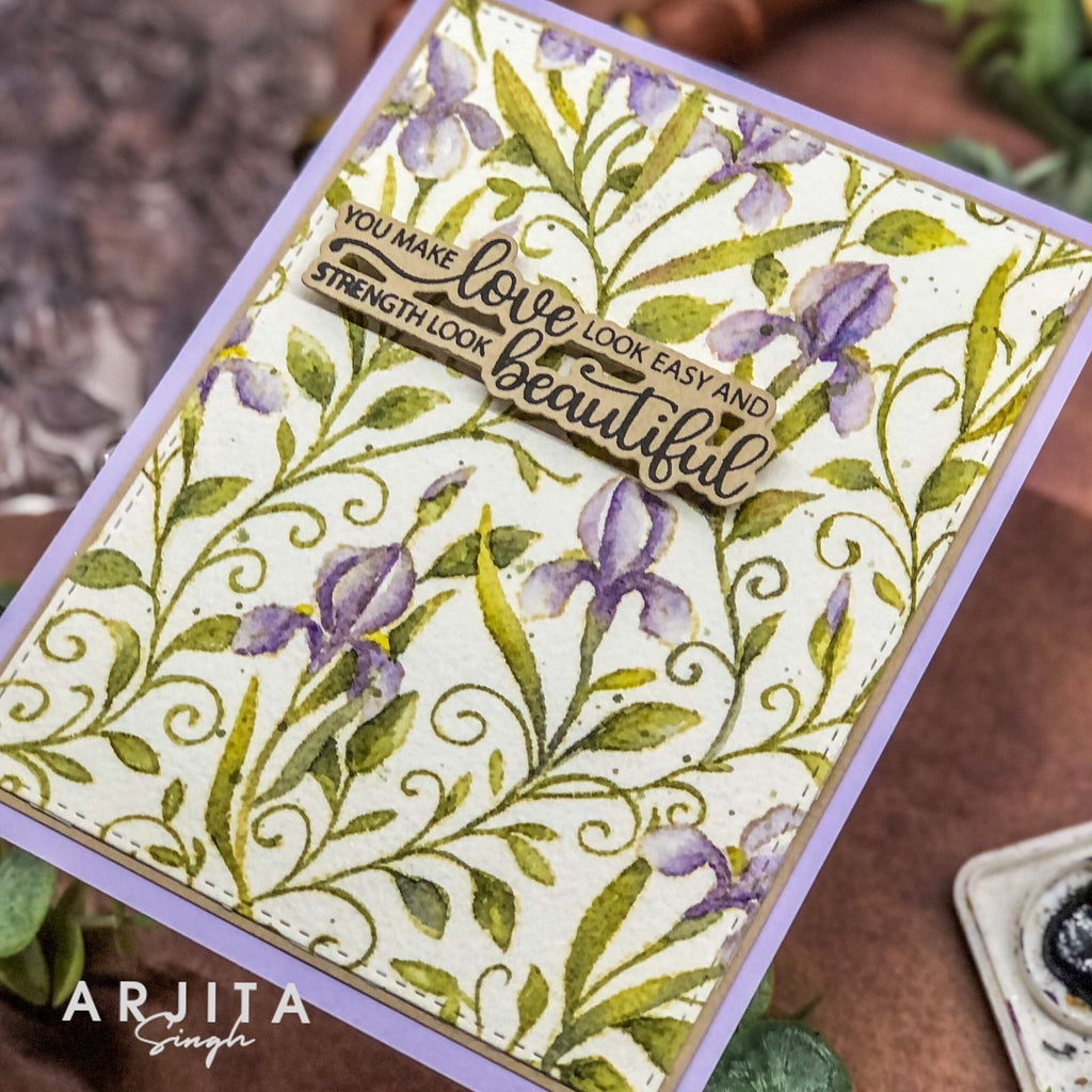 Card with floral design and motivational quote, featuring the artist's name 'Arijita Singh'.